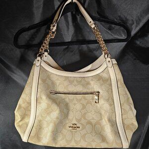 Coach leather logo bag with gold toned accents.
